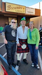 Brownie's Lounge owner Clair Brownie poses with patrons at the annual St. Patrick's Day party. 