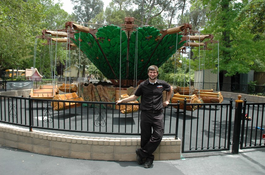 Funderland manager John Edds proudly stands in front of the new unnamed carnival ride at the park.   