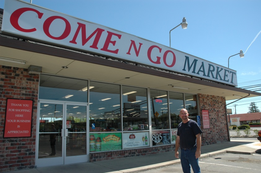 New Come-n-Go Market owner Pat Mulhall stands outside the new market on Freeport. 